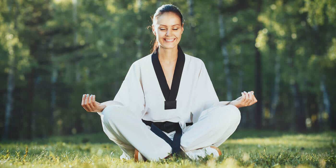 Martial Arts Lessons for Adults in Vista CA - Happy Woman Meditated Sitting Background